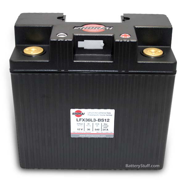 Picture of an Shorai LFX36L3-BS12 Battery. Black casing brass inlets for the terminals, and the right side is positive.